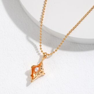 A o_1gkagg58c1ju1aojbld1k6330e2t with a pendant shaped like a leaping fox, featuring a natural pearl inset, displayed on a light, textured background. Elegant pearl jewelry