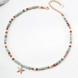 A delicate o_1hucrll2b1fmq1m481lvu11fe10e6b with a chain of small beads in shades of blue, red, and gold, interspersed with tiny white pearls. A starfish-shaped gold charm dangles from the center, making it perfect for summer fun. The necklace has an adjustable gold clasp. Elegant pearl jewelry